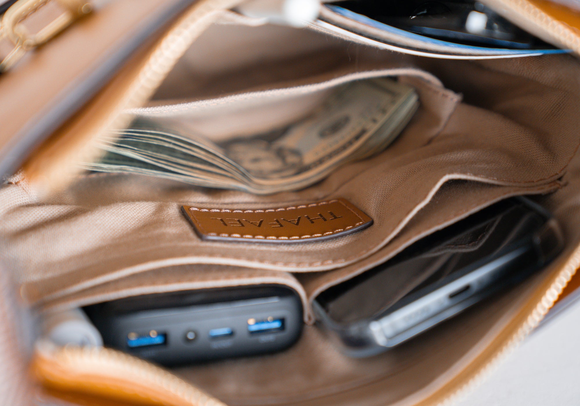 Crossbody travel bag with organized interior compartments for passport and phone