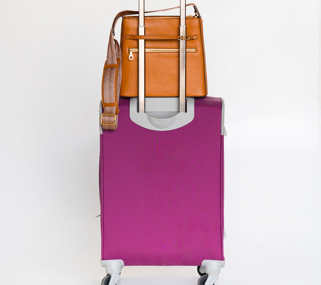 Thafael anti-theft crossbody bag with security clip attached to carry-on handle for travel safety
