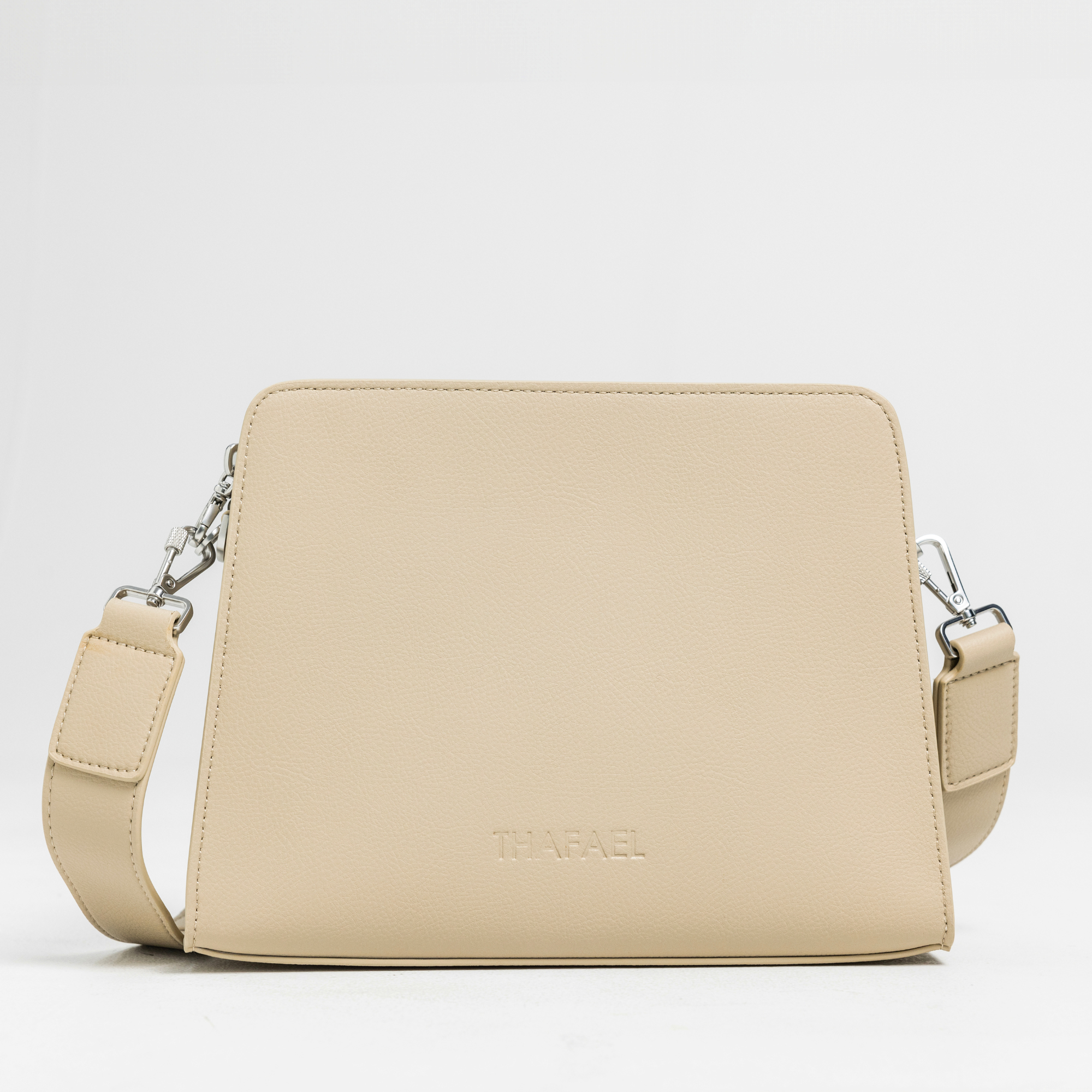 front view of thafael antitheft crossbody travel bag  in beige color