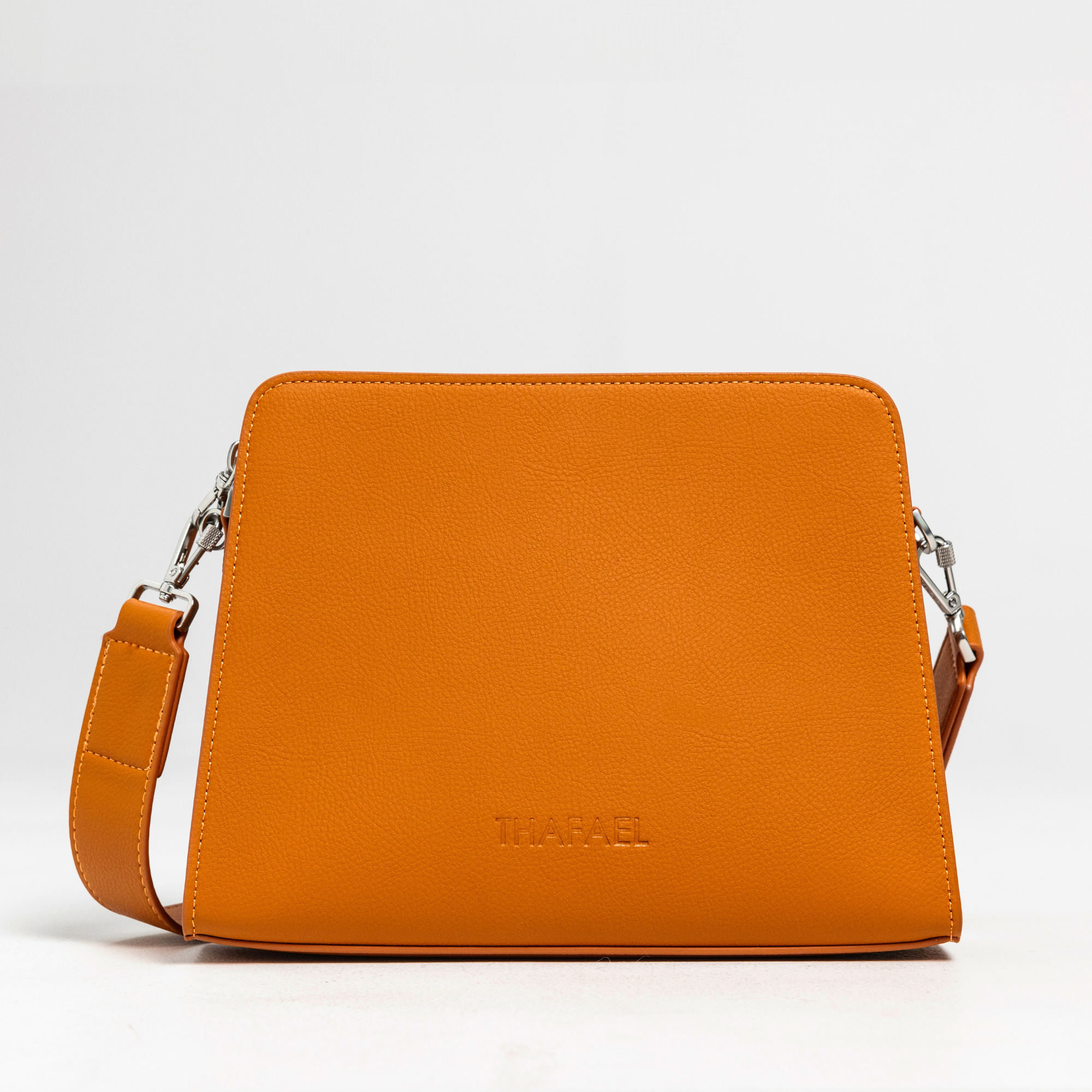 front view of thafael antitheft crossbody travel bag  in orange color